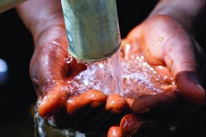 clean water in someone's hand